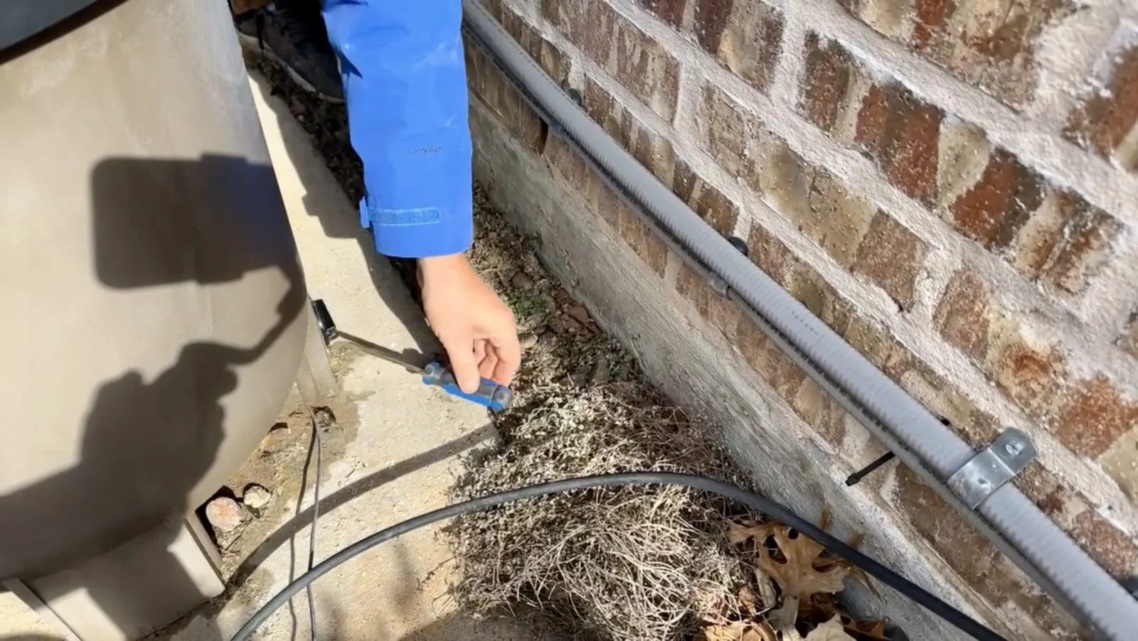 Taking out the drain plug from the back of a pool filter